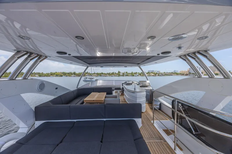 Slide: The Image of Luxurious 2017 Sunseeker 75 Yacht interior with spacious seating and scenic water views. - 16