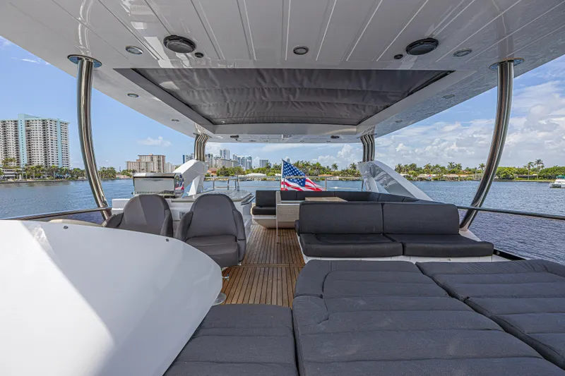 Slide: The Image of Luxurious 2017 Sunseeker 75 Yacht deck with seating, overlooking waterfront cityscape. - 21