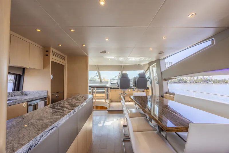 Slide: The Image of Luxurious interior of 2017 Sunseeker 75 Yacht with modern dining area and panoramic windows. - 32