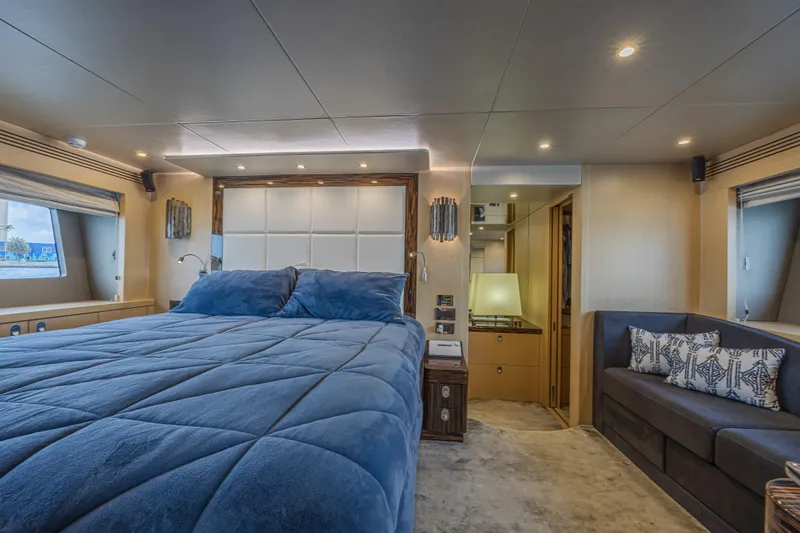 Slide: The Image of Luxurious bedroom interior of 2017 Sunseeker 75 Yacht with plush blue bedding and elegant decor. - 39