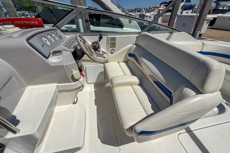 Slide: The Image of Interior of a 2001 Formula 280 Sun Sport boat with white seating and dashboard. - 10