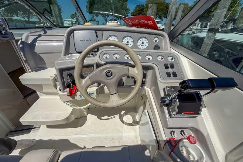 Slide: The Image of Cockpit of 2001 Formula 280 Sun Sport boat with steering wheel and control panel. - 12