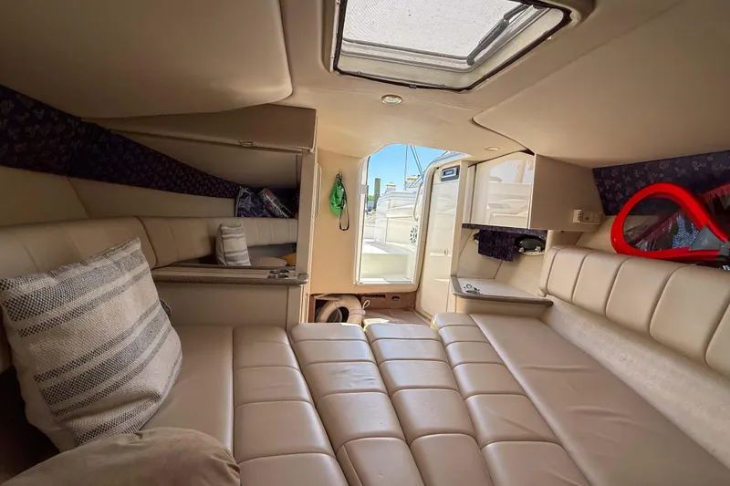 Slide: The Image of Interior of 2001 Formula 280 Sun Sport boat with beige seating and open hatch. - 17