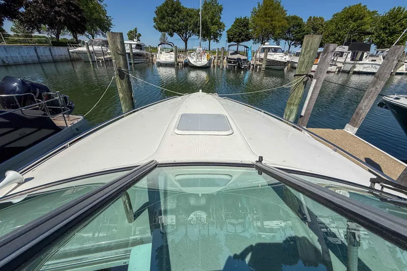 Slide: The Image of Front view of 2001 Formula 280 Sun Sport boat docked at marina. - 18