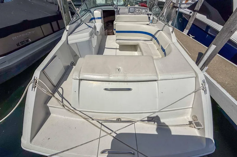Slide: The Image of 2001 Formula 280 Sun Sport boat with spacious seating and sleek design at a marina. - 3