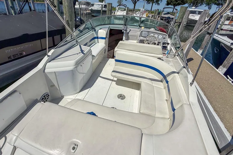 Slide: The Image of 2001 Formula 280 Sun Sport boat interior with white seating and control panel. - 5