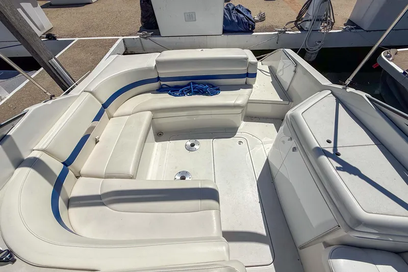 Slide: The Image of 2001 Formula 280 Sun Sport boat interior with white seating and blue accents. - 8