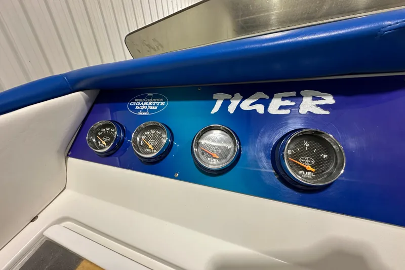 Slide: The Image of Dashboard of 2000 Cigarette 42' Tiger boat with gauges and logo. - 17