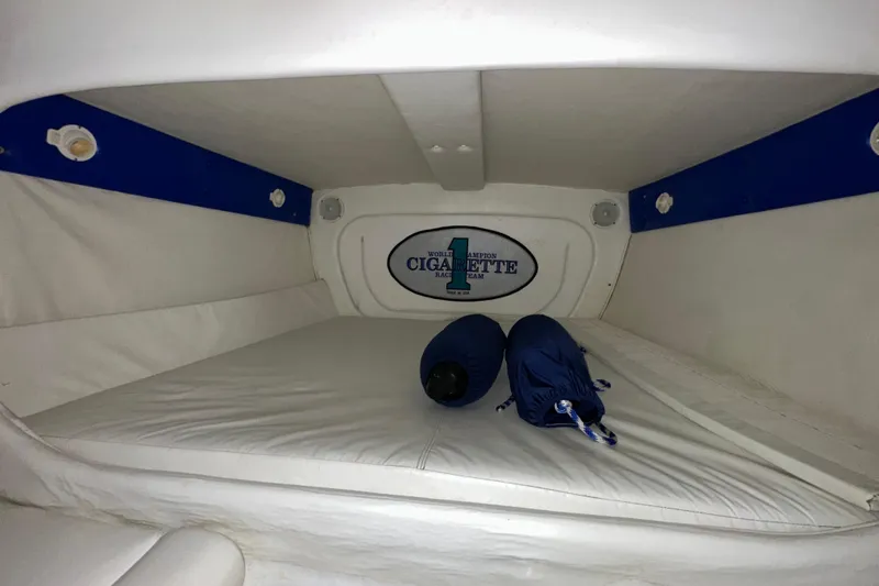Slide: The Image of Interior cabin of a 2000 Cigarette 42' Tiger boat with white and blue accents. - 22