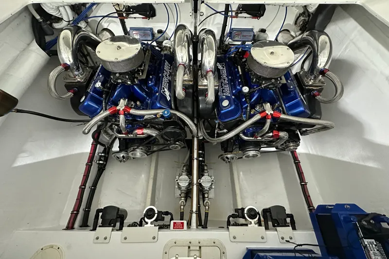 Slide: The Image of Twin Mercury Racing engines in a 2000 Cigarette 42' Tiger boat engine compartment. - 7