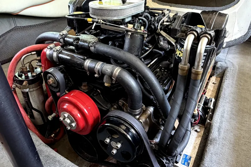 Slide: The Image of 2005 Nautique Air Nautique 206 engine, showcasing detailed components and hoses. - 3