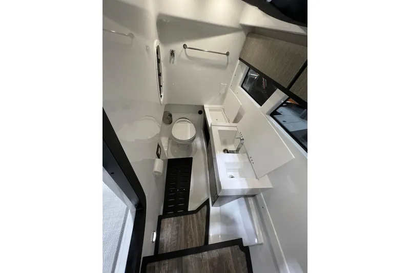 Slide: The Image of Interior of 2023 Monterey 378SS Super Sport boat bathroom with modern fixtures and sleek design. - 16