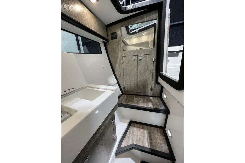Slide: The Image of Interior of 2023 Monterey 378SS Super Sport boat, featuring sleek cabinetry and modern design. - 17