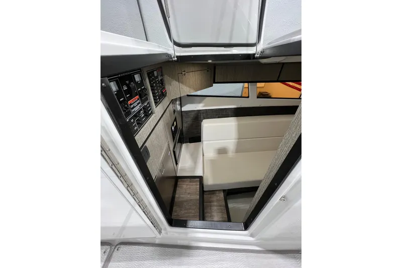 Slide: The Image of Interior view of 2023 Monterey 378SS Super Sport boat, featuring seating and control panels. - 18