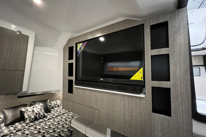 Slide: The Image of 2023 Monterey 378SS Super Sport interior with modern TV setup and stylish seating area. - 23