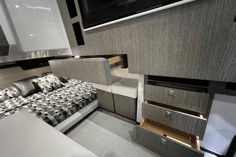 Slide: The Image of Interior of 2023 Monterey 378SS Super Sport with modern cabinetry and geometric-patterned bedding. - 25