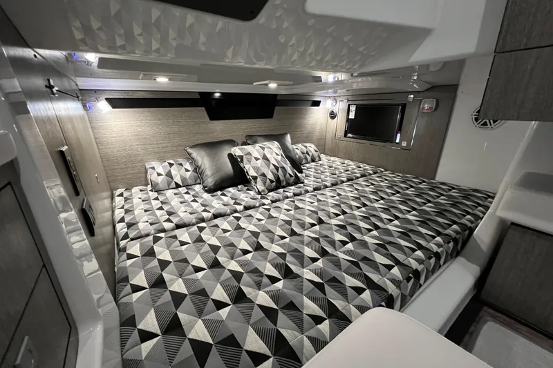 Slide: The Image of Luxurious cabin interior of 2023 Monterey 378SS Super Sport with geometric bedding design. - 27