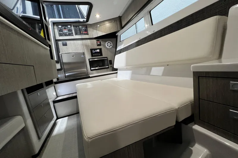 Slide: The Image of Interior of 2023 Monterey 378SS Super Sport boat with modern seating and control panel. - 32