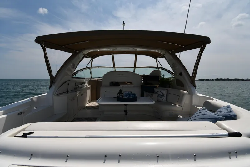 Slide: The Image of The image shows the cockpit of a 2000 Sea Ray Sundancer 460 on the water. - 10