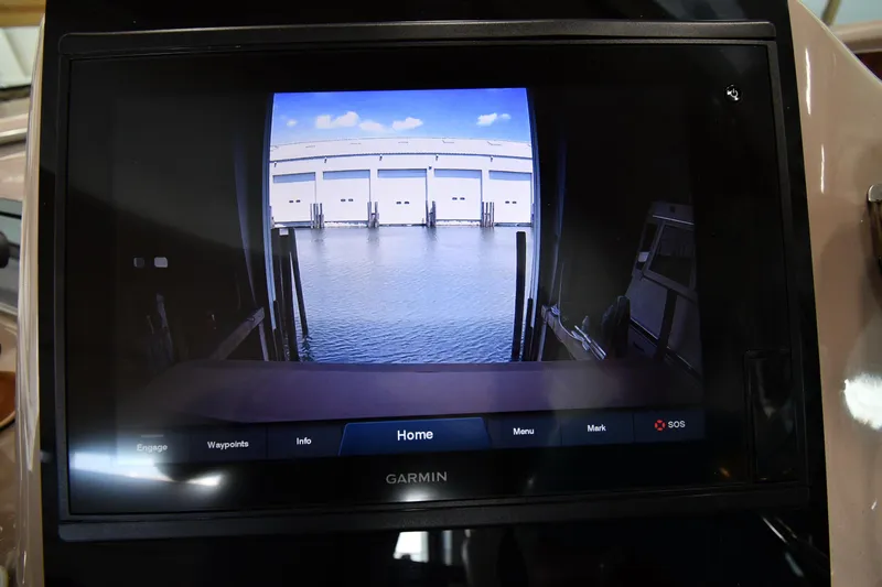 Slide: The Image of A screen displays a view of a dock with water and buildings in the background. - 15