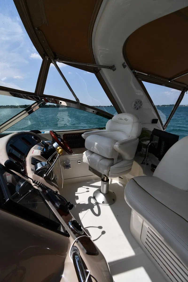 Slide: The Image of Interior view of a 2000 Sea Ray Sundancer 460 with helm and seating. - 20