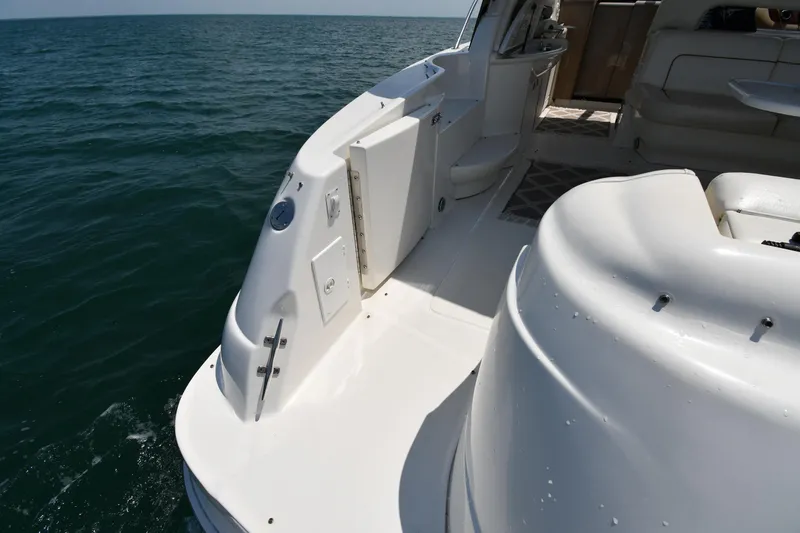 Slide: The Image of The image shows the deck of a 2000 Sea Ray Sundancer 460 on the water. - 23