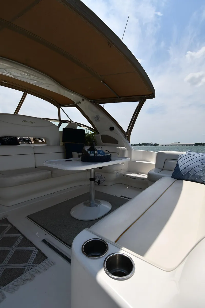 Slide: The Image of The image shows the cockpit of a 2000 Sea Ray Sundancer 460 with comfortable seating. - 26