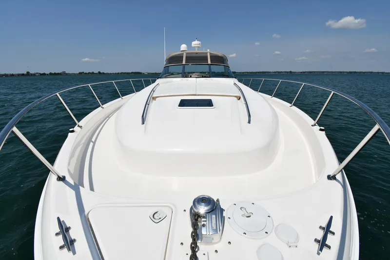 Slide: The Image of The image shows the bow deck of a 2000 Sea Ray Sundancer 460 on the water. - 3