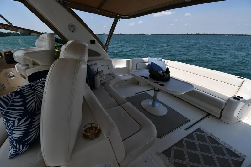 Slide: The Image of The image shows the cockpit of a 2000 Sea Ray Sundancer 460 on the water. - 30