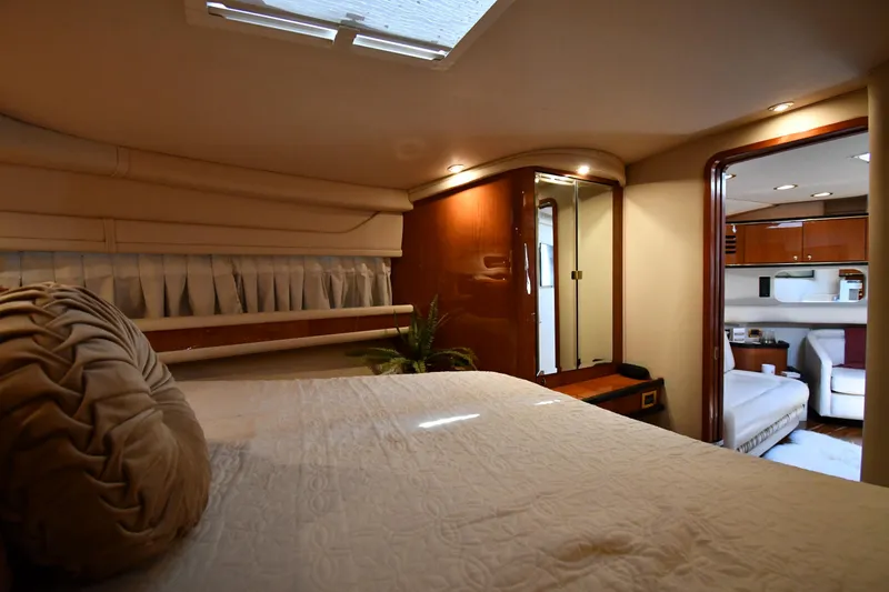 Slide: The Image of Interior of a 2000 Sea Ray Sundancer 460 with a cozy bedroom and modern design. - 40