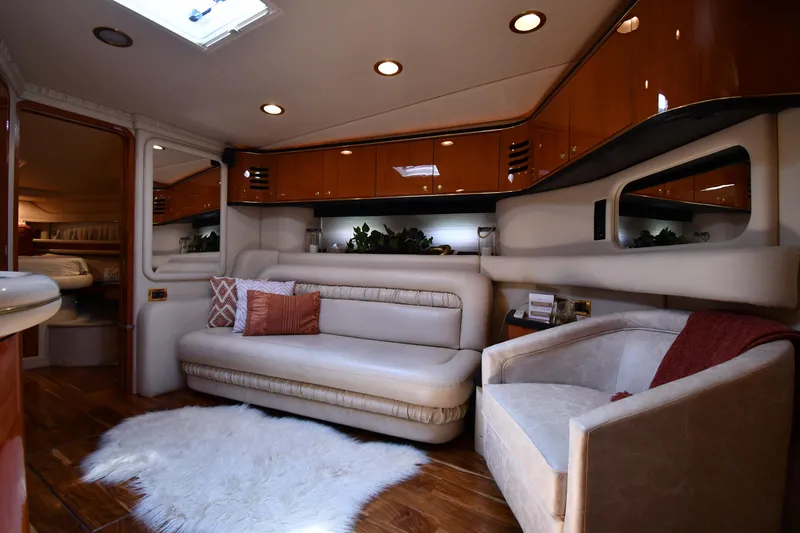 Slide: The Image of Interior of a 2000 Sea Ray Sundancer 460 with elegant seating area and wooden floor. - 45
