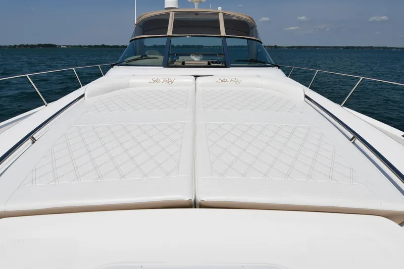 Slide: The Image of The image shows the foredeck of a 2000 Sea Ray Sundancer 460 on the water. - 6