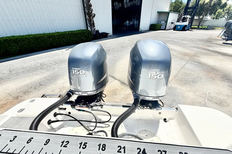 Slide: The Image of Twin Yamaha 150 engines on a 2012 Robalo R247 Dual Console boat. - 6