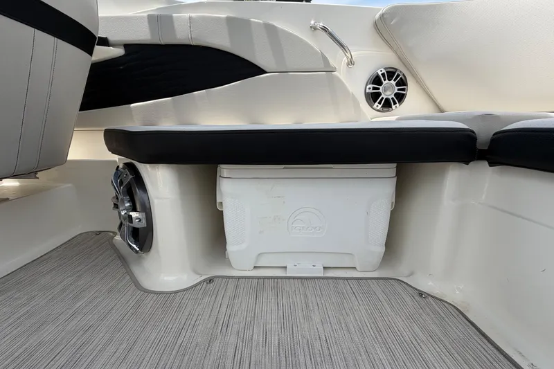 Slide: The Image of Interior of 2023 Sea Ray SPX 210 Outboard with seating and storage area. - 49