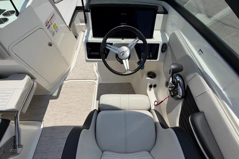 Slide: The Image of Interior view of a Sea Ray SPX 210 Outboard with modern steering wheel and control console. - 18