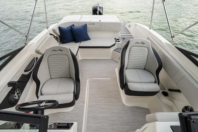 Slide: The Image of Manufacturer Provided Image: 2023 Sea Ray SPX 210 OB boat interior with plush seating and modern design. - 12