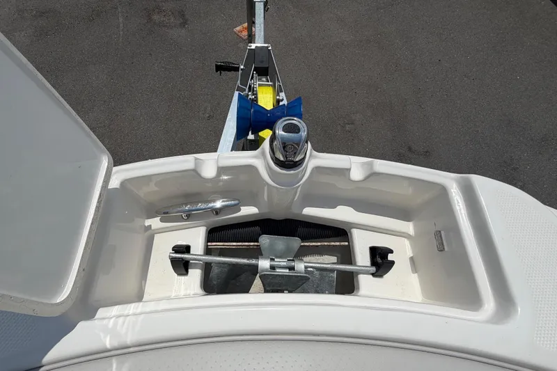 Slide: The Image of Anchor compartment of a 2023 Sea Ray SPX 210 Outboard. - 35