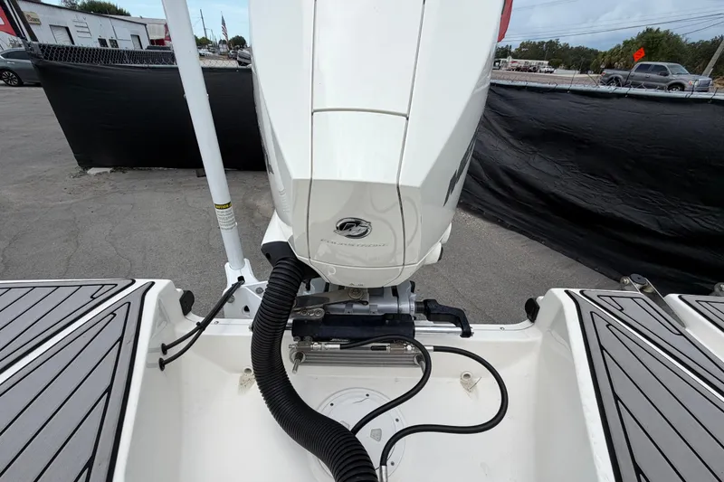 Slide: The Image of 2023 Sea Ray SPX 210 Outboard motor, rear view, in a parking area. - 64