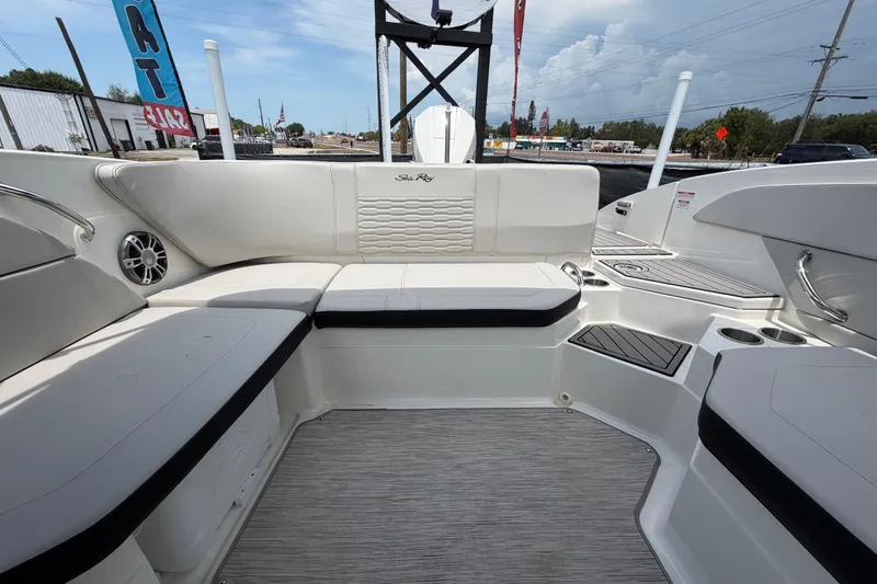 Slide: The Image of 2023 Sea Ray SPX 210 Outboard boat interior with white seating and modern design. - 47