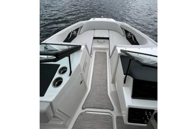 Slide: The Image of The image shows the cockpit of a Sea Ray SPX 210 Outboard boat on the water. - 2