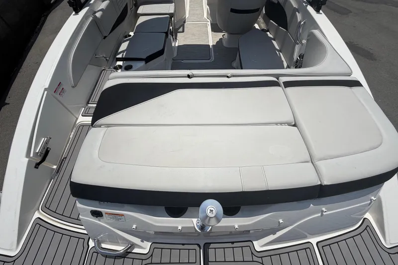 Slide: The Image of Interior view of a Sea Ray SPX 210 Outboard with gray and black upholstery. - 12