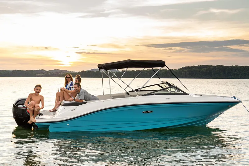 Slide: The Image of Manufacturer Provided Image: 2023 Sea Ray SPX 210 OB boat on water at sunset with people onboard. - 6