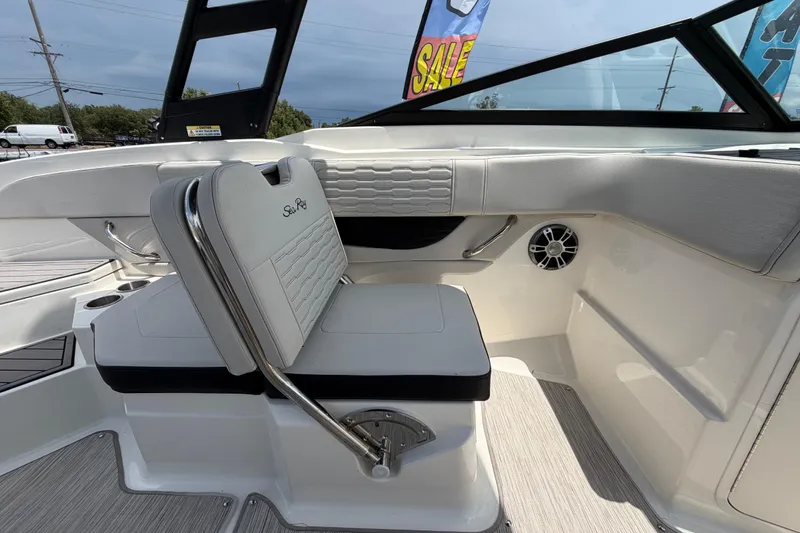 Slide: The Image of 2023 Sea Ray SPX 210 Outboard boat interior with white seating and modern design. - 42