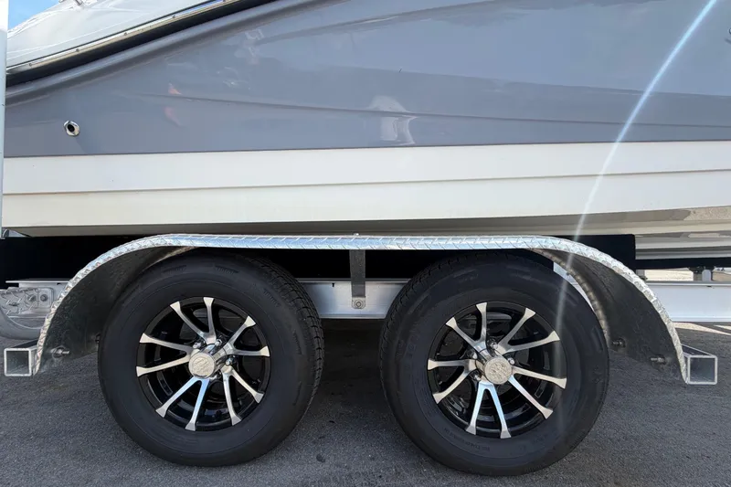 Slide: The Image of Trailer wheels of a 2023 Sea Ray SPX 210 Outboard boat. - 68