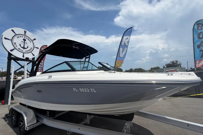 The Image of 2023 Sea Ray SPX 210 Outboard boat on display at a dealership. - 0