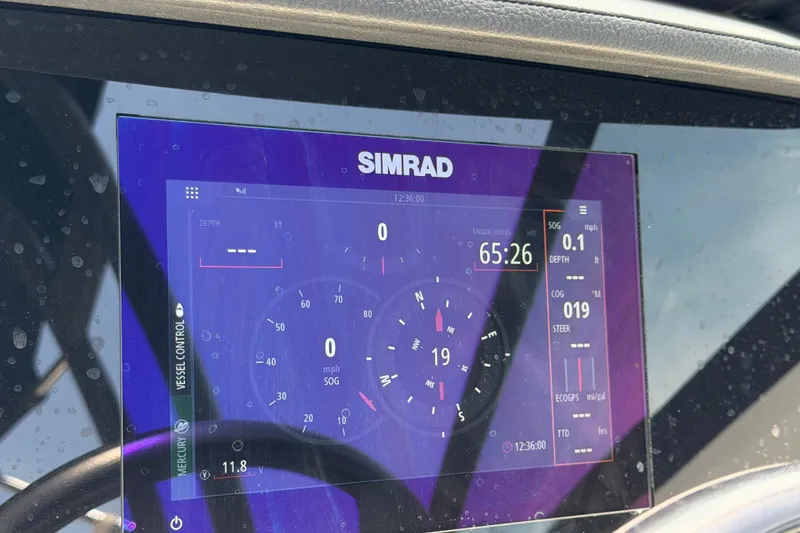 Slide: The Image of Simrad display on 2023 Sea Ray SPX 210 Outboard showing navigation and engine data. - 19