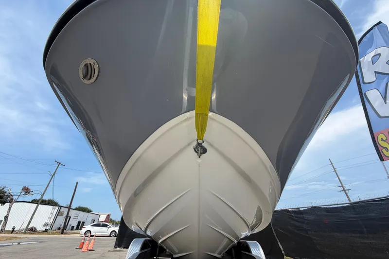 Slide: The Image of 2023 Sea Ray SPX 210 Outboard boat, front view, displayed outdoors. - 10