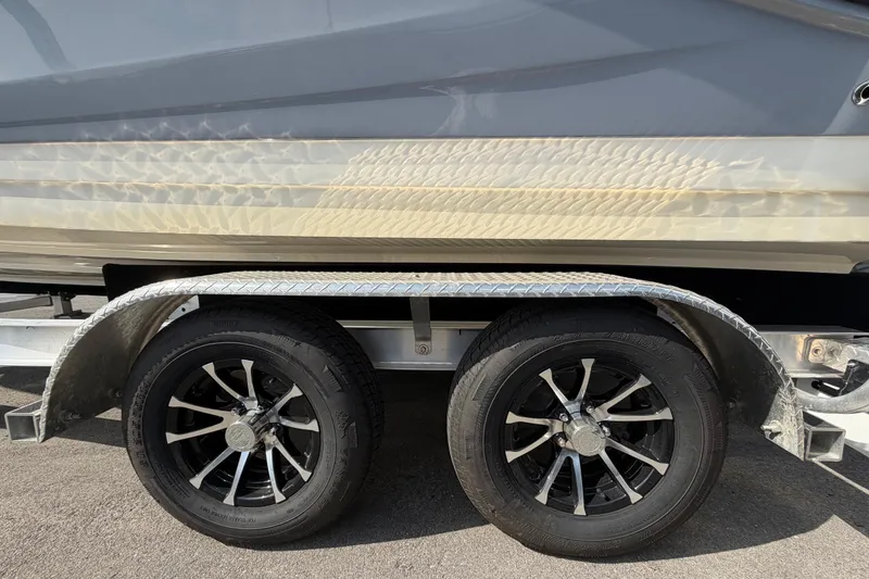 Slide: The Image of 2023 Sea Ray SPX 210 Outboard on trailer with dual black alloy wheels. - 69