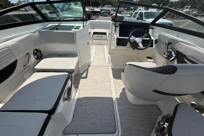 Slide: The Image of 2023 Sea Ray SPX 210 Outboard boat interior with modern seating and steering console. - 16