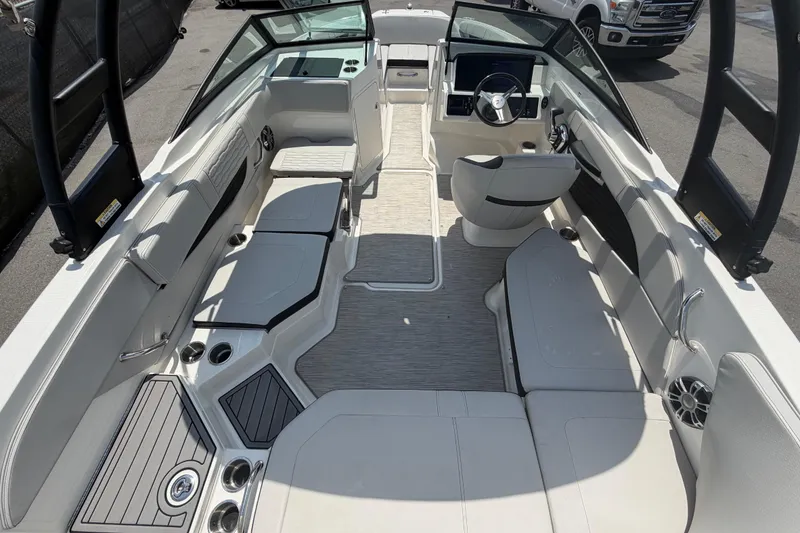 Slide: The Image of 2023 Sea Ray SPX 210 Outboard boat interior with sleek seating and modern design. - 14